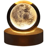 Glowing planetary galaxy crystal ball night light on wooden base