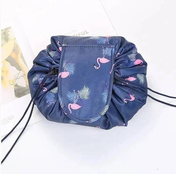 Chic waterproof drawstring makeup organizer with pink flamingo pattern on navy fabric