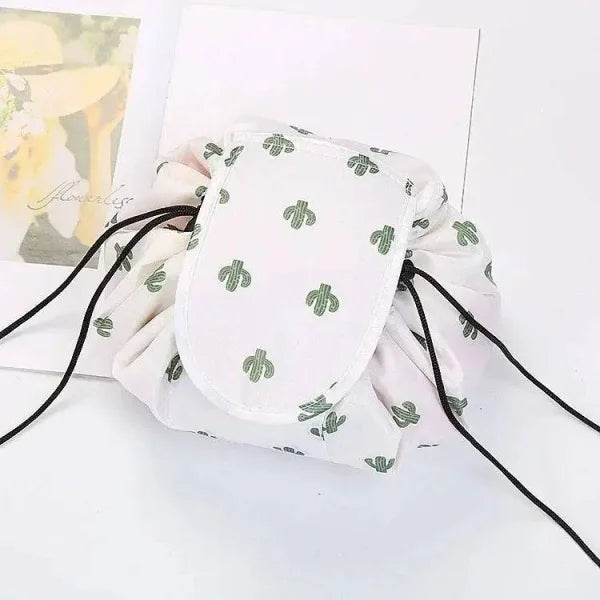 White waterproof drawstring makeup organizer with green cactus print