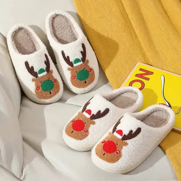 Two pairs of white plush reindeer cozy winter slippers for holiday footwear