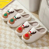 Two pairs of cozy winter slippers with reindeer themes and red green noses