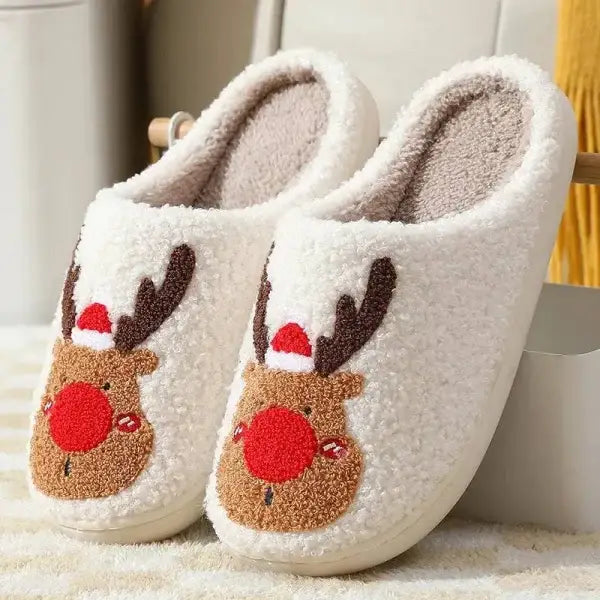 Cozy white reindeer slippers in Santa hats, holiday footwear