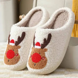 Cozy white reindeer slippers in Santa hats, holiday footwear