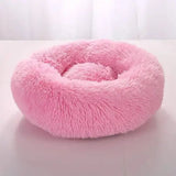 Fluffy pink round pet bed in comfortable coral fleece for furry friend