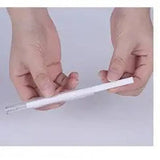 White plastic straw held in fingers by Magic Shadow USB air humidifier