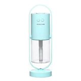 Mint-colored Magic Shadow USB air humidifier with clear tank, handle, night light and projection