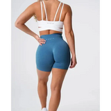 Nvgtn Seamless Pro Spandex Shorts: Blue High-Waisted with White Bra