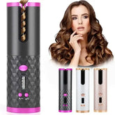 Portable cordless rechargeable hair curler with black geometric pattern and pink accents