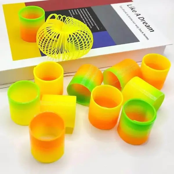 24PCS Rainbow Magic Springs Circle Toys Kids Birthday Party Favors Guests Giveaway Small Gifts Pinata Fillers Flexible