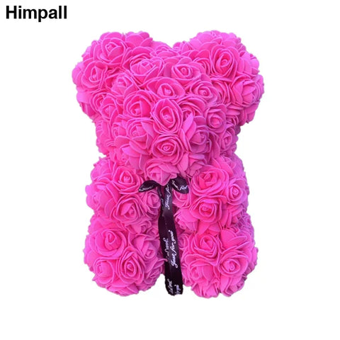 Pink Rose Teddy Bear made of artificial flowers with a black bow for special occasions