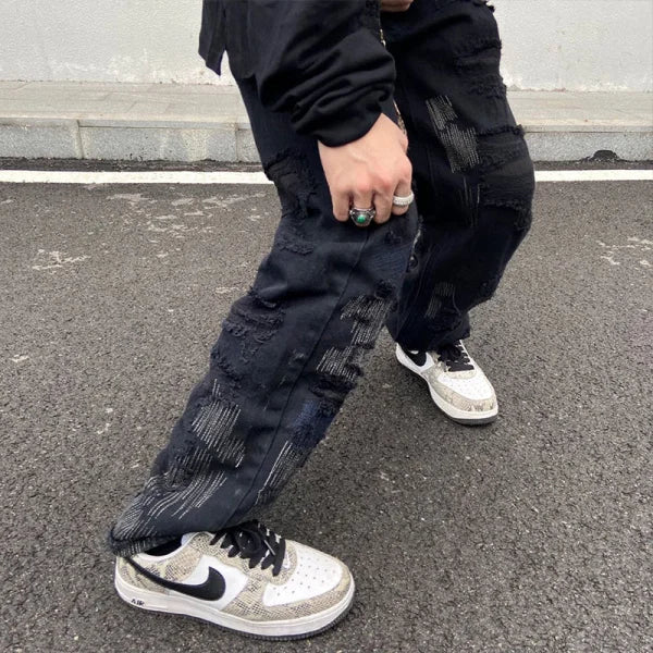 Distressed black cargo pants with rips from 7TT Original National Chaogao collection