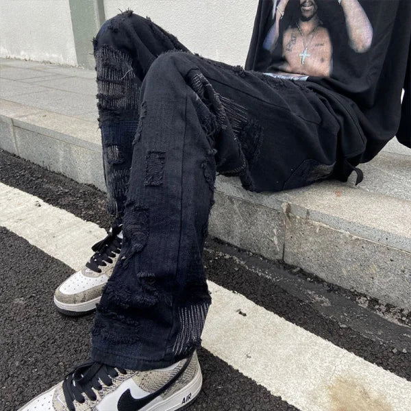 Pair of heavily distressed black jeans from 7TT Original National Chaogao for men