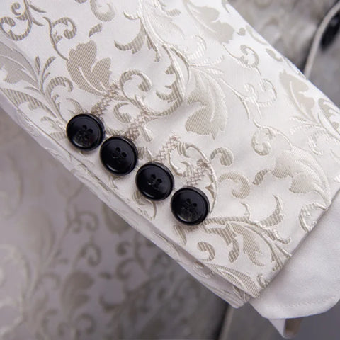 Sleeve cuff of a white patterned wedding dress suit set with four black buttons