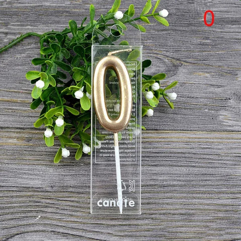 Gold metallic number zero birthday candle on a clear holder for champagne gold paraffin