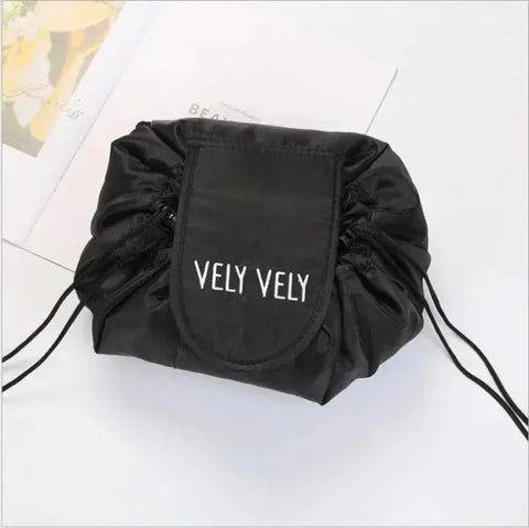 Black drawstring cosmetic bag with VELY VELY text in chic waterproof design for travel