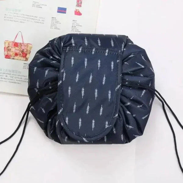 Navy blue waterproof drawstring makeup organizer with white arrow pattern design