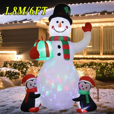 Inflatable snowman with penguin decorations for a festive Christmas atmosphere