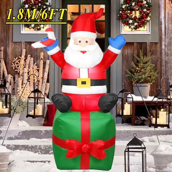 Inflatable Santa Claus decoration on green gift box enhancing the Christmas atmosphere