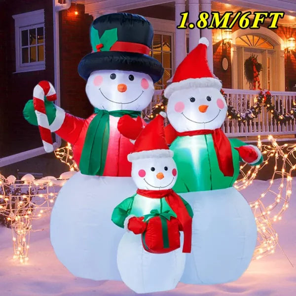 Three inflatable snowmen with scarves and hats create a festive Christmas atmosphere