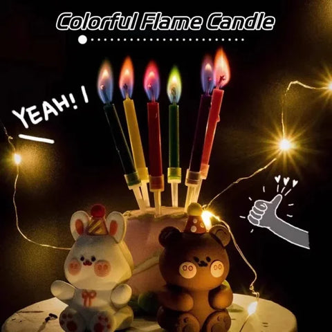 Birthday cake with colored flame stick candles and bear ornaments for celebrations