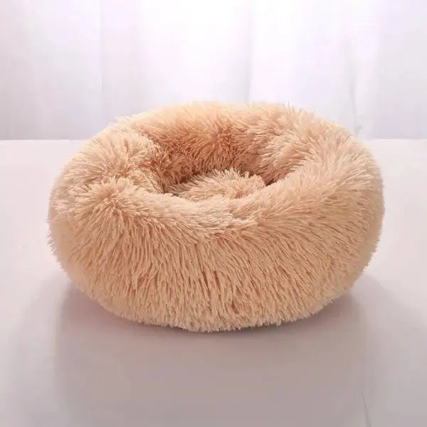 Comfortable coral fleece round pet bed for furry friend in beige plush