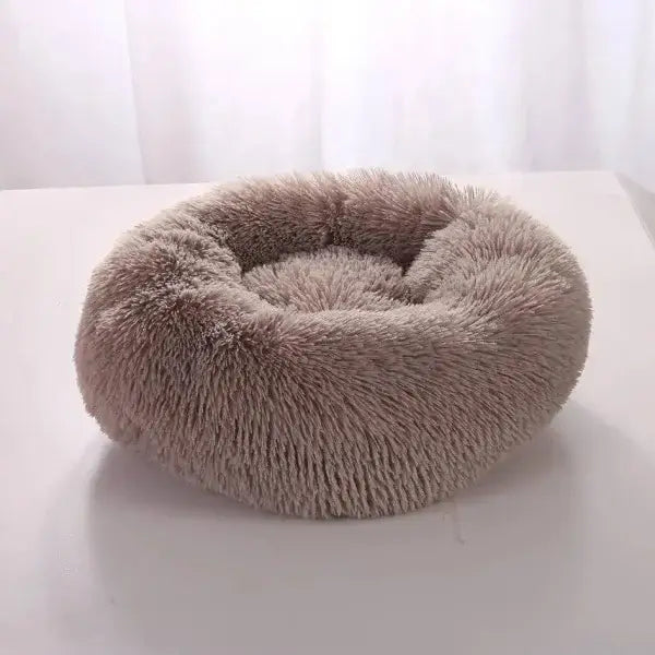 Comfortable coral fleece round pet bed for furry friend with plush beige fur