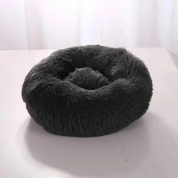 Fluffy black round pet bed in comfortable coral fleece for furry friend