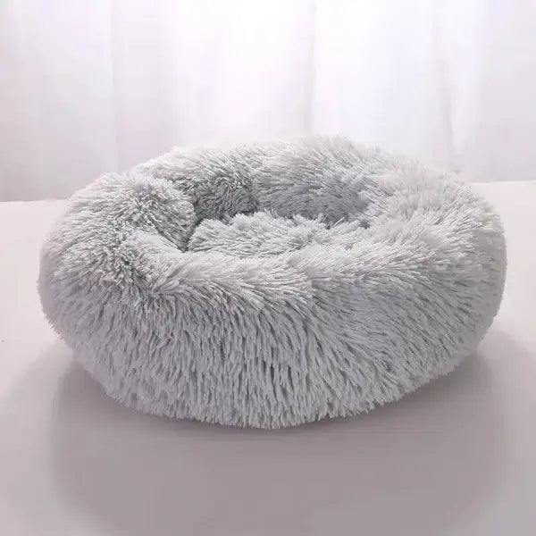 Comfortable coral fleece round pet bed for furry friend with plush gray fur