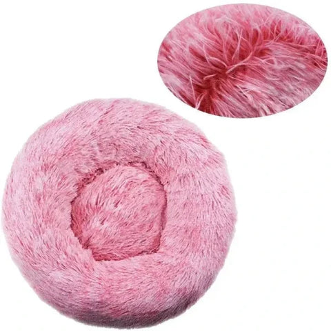 Pink fluffy round pet bed made of comfortable coral fleece for your furry friend