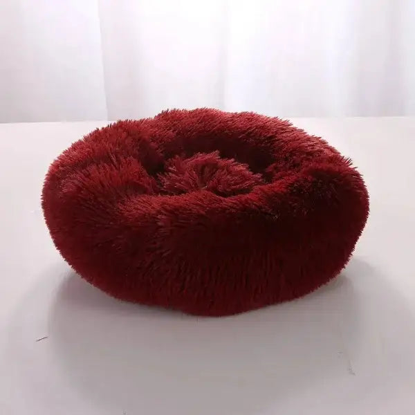 Plush burgundy round pet bed in comfortable coral fleece for furry friend