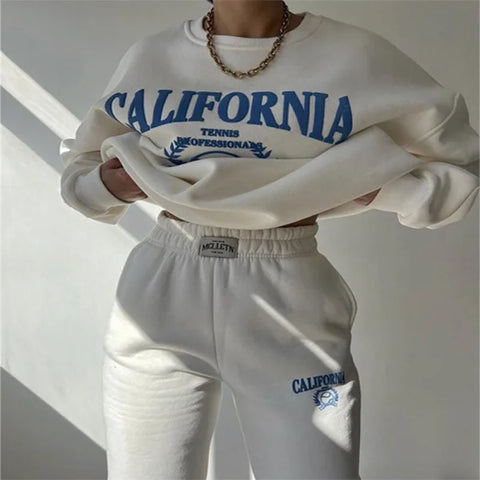 White sweatshirt and sweatpants set from Commuting Collection featuring CALIFORNIA in blue