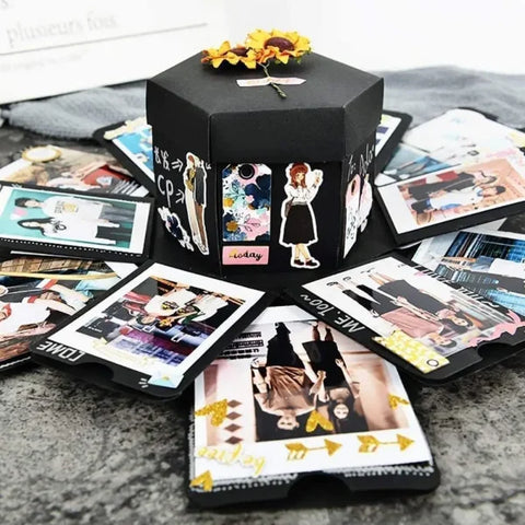 Black hexagonal DIY photo album gift box with stickers and scattered photographs
