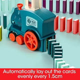 Electric domino train toy with teal engine knocking colorful dominos