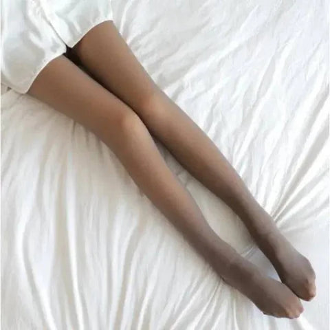 Legs in sheer brown fleece lined stockings on white fabric, ideal for women’s winter hosiery