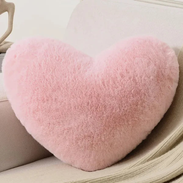 Pink fluffy heart pillow perfect for Valentine’s Day decor in heart shape design