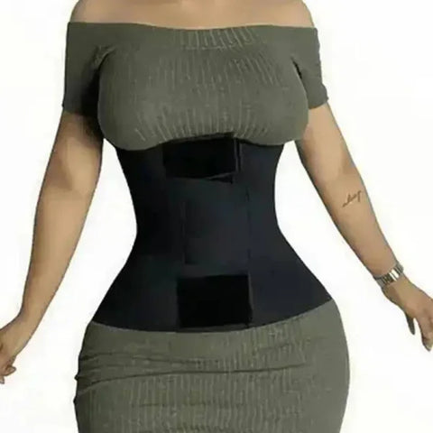Black compression waist trainer corset over gray dress in high compression slimming sheath
