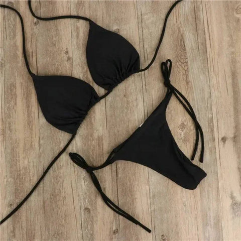 Black halter neck bikini with triangle top and side-tie bottoms for a trendy two piece swimsuit