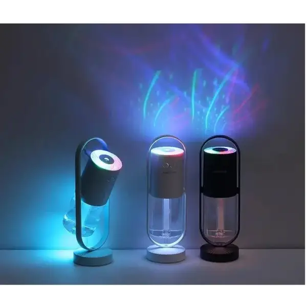 Three glowing Magic Shadow USB air humidifiers with LED night light projection