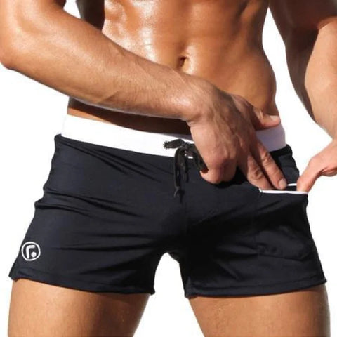 Black athletic shorts with drawstring, part of Marcin Men Swimwear in durable nylon fabric composition
