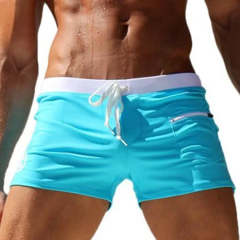 Bright turquoise Marcin Men Swimwear with white waistband, crafted from durable nylon fabric