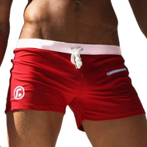 Red swim shorts with white waistband in Marcin Men Swimwear featuring durable nylon fabric composition
