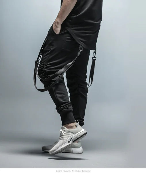 Black fitness pant men sweatpants with zipper details, straps, white sneakers