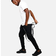 Man in white t-shirt, black fitness pant men sweatpants with suspenders