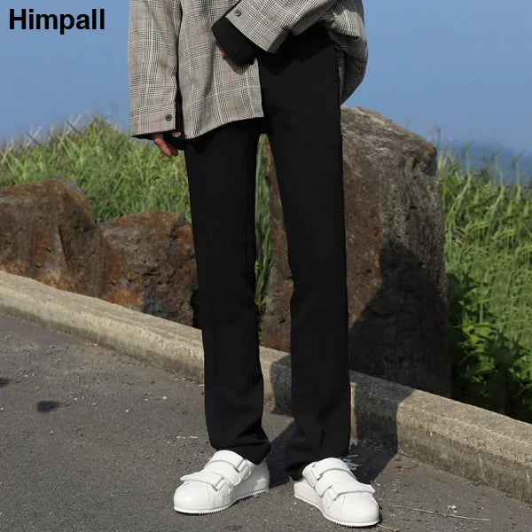 Black trousers with white sneakers showcasing Men’s Solid Color Casual Pants style