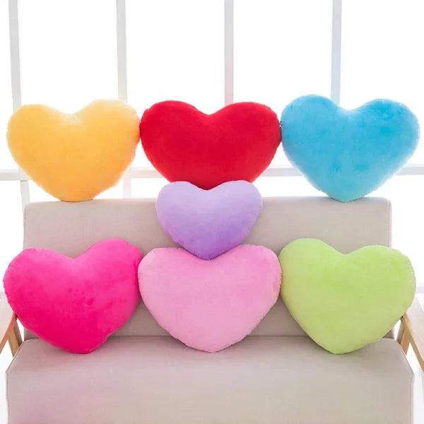 Colorful heart-shaped plush seat cushions for Valentine’s Day decorating arrangement