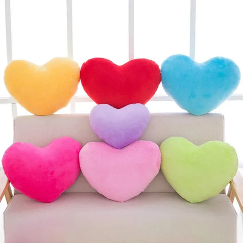 Colorful heart-shaped plush seat cushions for Valentine’s Day decorating arrangement