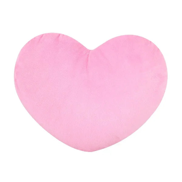 Pink heart-shaped seat cushion ideal for Valentine’s Day decorating or as a sleeping pillow
