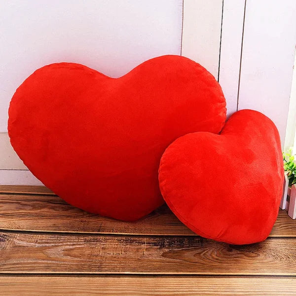 Two red heart-shaped plush pillows as a modern seat cushion for Valentine’s Day