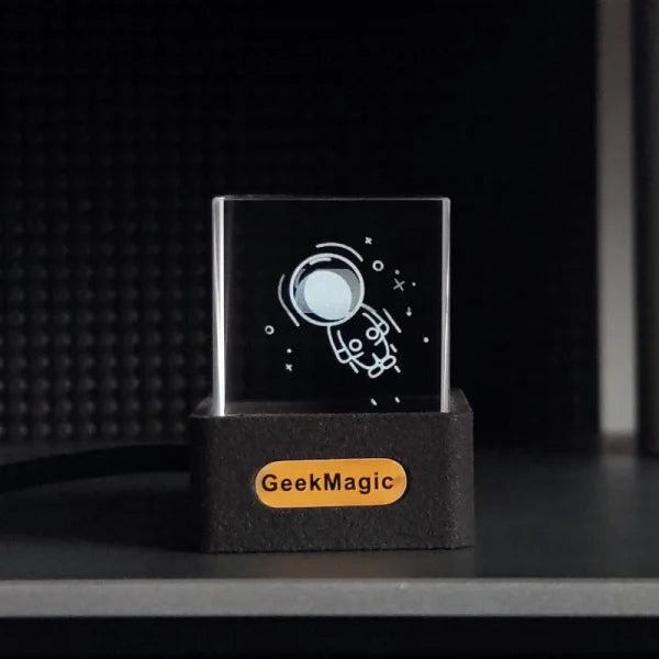 Glass cube with etched astronaut design on GeekMagic base for modern simplicity function weather and time display in global cities