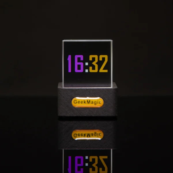 Digital clock displaying 16:32 with purple and yellow numbers on black base for global city weather and time display